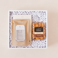 Load image into Gallery viewer, Desk essentials corporate gift box with Touchland Beach Coco hand sanitizer, notepad, gold pen, and The Art of Caramel vanilla bean cocoa nib gourmet caramel popcorn in a white box with crinkle paper