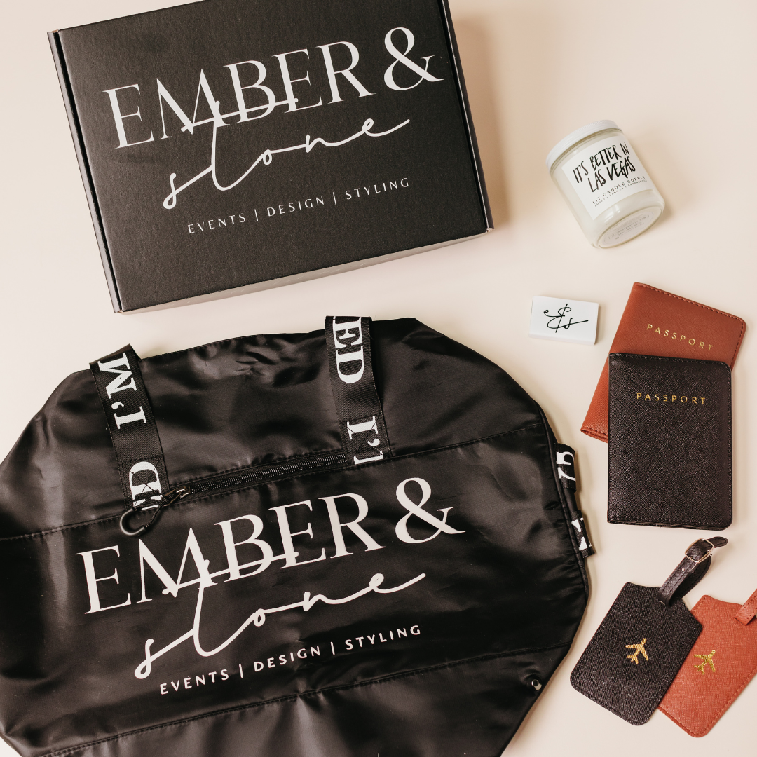 Branded client gifting package with custom tote bag, candle, passport holders, and luggage tags, showcasing the behind-the-scenes experience of working with a gifting partner.