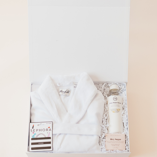 White bridesmaid gift box with plush robe, coconut vanilla soap, rose water bottle, and Sephora gift card - curated by Lavender + Pine.