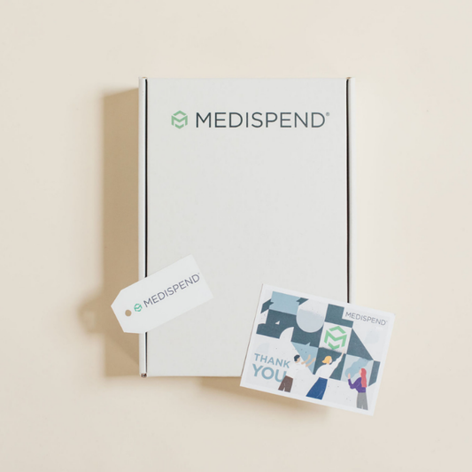Branded custom corporate gift box with Medispand logo, personalized gift tag, and illustrated thank-you card, designed by Lavender + Pine.