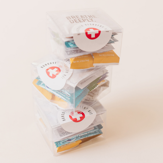 Hangover recovery kits stacked tall in clear acrylic boxes