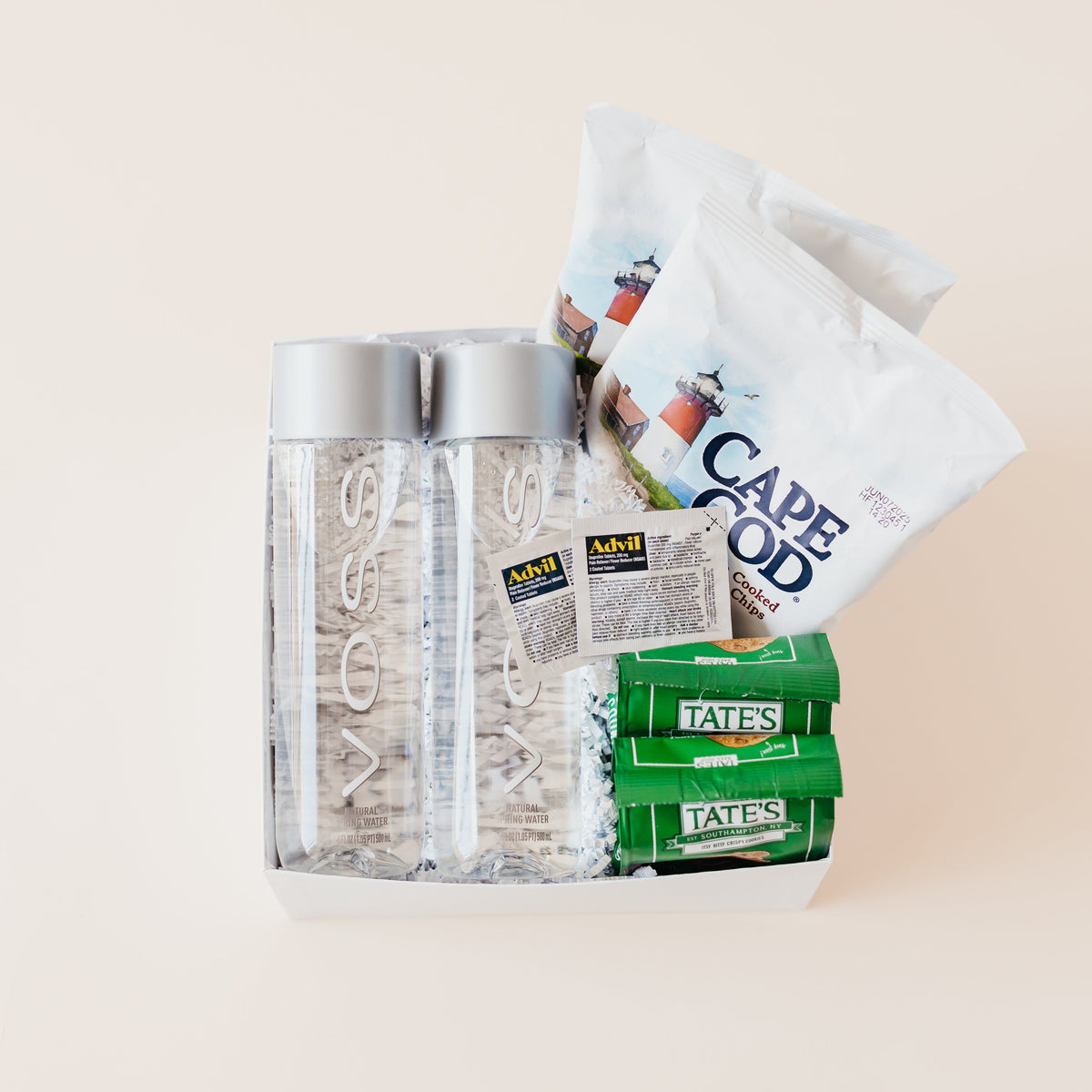 Classic Welcome gift box with bottled water, snacks, cookies, and travel essentials